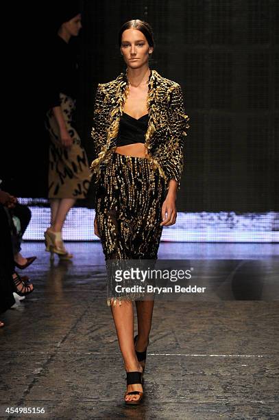 Model walks the runway at the Donna Karan New York 30th Anniversary fashion show during Mercedes-Benz Fashion Week Spring 2015 on September 8, 2014...