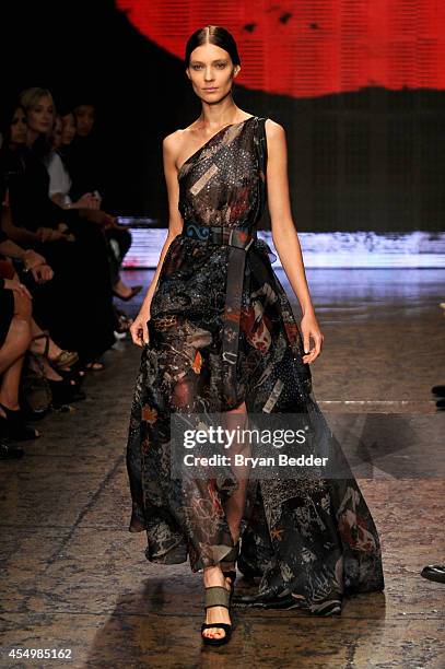 Model walks the runway at the Donna Karan New York 30th Anniversary fashion show during Mercedes-Benz Fashion Week Spring 2015 on September 8, 2014...