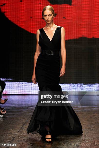 Model walks the runway at the Donna Karan New York 30th Anniversary fashion show during Mercedes-Benz Fashion Week Spring 2015 on September 8, 2014...