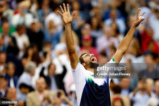 Marin Cilic of Croatia reacts after defeating Kei Nishikori of Japan to win the men's singles final match on Day fifteen of the 2014 US Open at the...