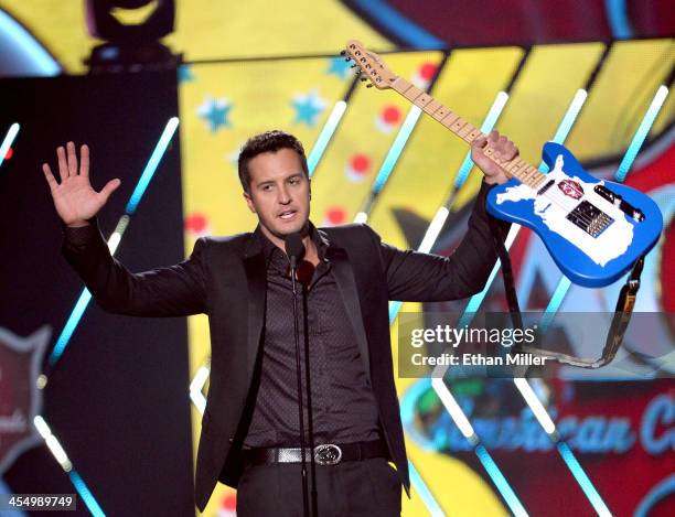 Recording artist Luke Bryan accepts the award for Artist of the Year onstage during the American Country Awards 2013 at the Mandalay Bay Events...