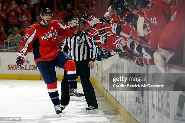 Troy Brouwer of the Washington Capitals celebrates after scoring the game-winning goal in a shootout during an NHL game against the Tampa Bay...