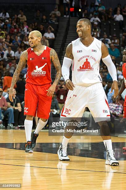 Rapper Chris Brown and actor Robert Christopher Riley attend the 2014 Summer Classic Charity Basketball Game at Barclays Center on August 21, 2014 in...