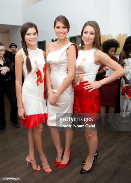 Miss Teen USA 2014 K. Lee Graham, Miss Universe 2014 Gabriela Isler and Miss USA 2014 Nia Sanchez attend the Helen Yarmak Int'l Presentaion during...