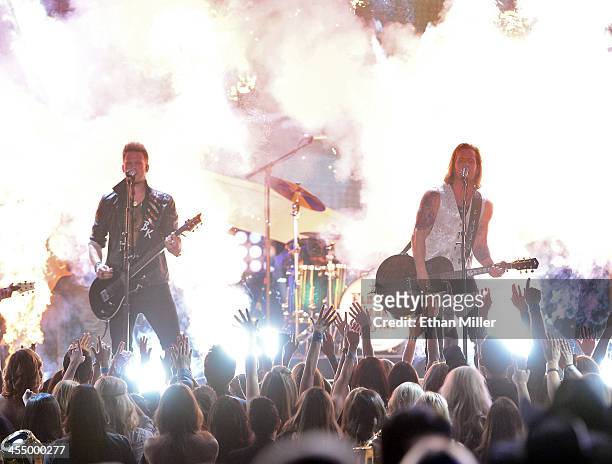 Recording artists Tyler Hubbard and Brian Kelley of Florida Georgia Line perform onstage during the American Country Awards 2013 at the Mandalay Bay...