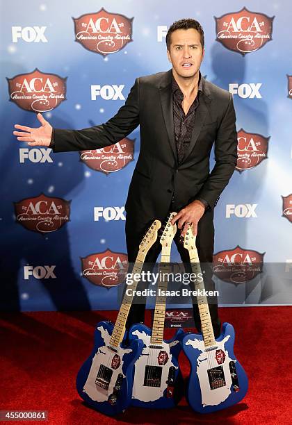 Singer Luke Bryan poses in the press room during the American Country Awards 2013 at the Mandalay Bay Events Center on December 10, 2013 in Las...