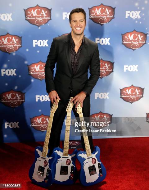 Singer Luke Bryan poses in the press room during the American Country Awards 2013 at the Mandalay Bay Events Center on December 10, 2013 in Las...