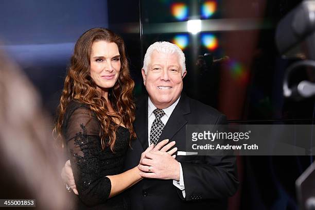 Actress Brooke Shields and designer Dennis Basso attend the Dennis Basso Store Opening at Dennis Basso Store on December 10, 2013 in New York City.
