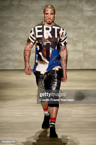 Model walks the runway at the Libertine fashion show during Mercedes-Benz Fashion Week Spring 2015 at The Pavilion at Lincoln Center on September 8,...