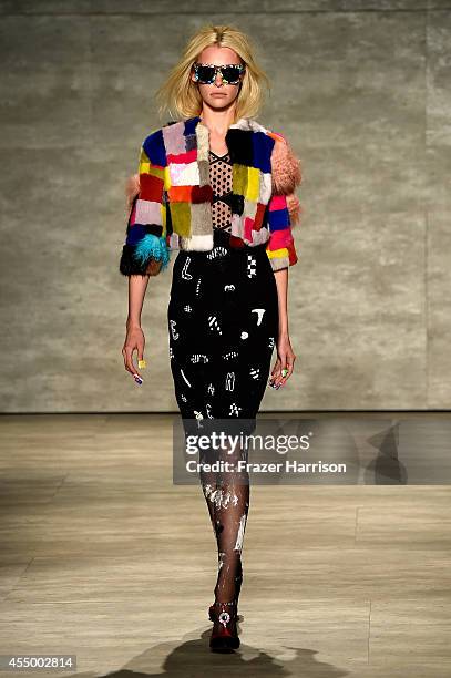 Model walks the runway at the Libertine fashion show during Mercedes-Benz Fashion Week Spring 2015 at The Pavilion at Lincoln Center on September 8,...