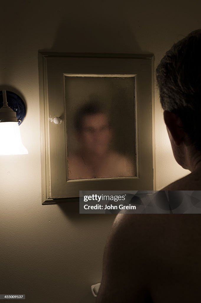 Man confronts his murky image in the mirror...