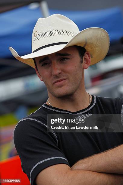 Austin Dillon, driver of the American Ethanol Chevrolet, stands in the garage area during the NASCAR Camping World Truck Series inaugural CarCash...