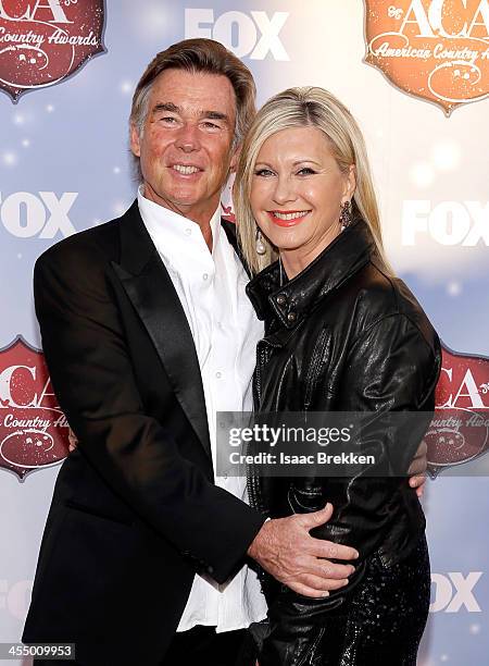 John Easterling and actress Olivia Newton-John arrive at the American Country Awards 2013 at the Mandalay Bay Events Center on December 10, 2013 in...