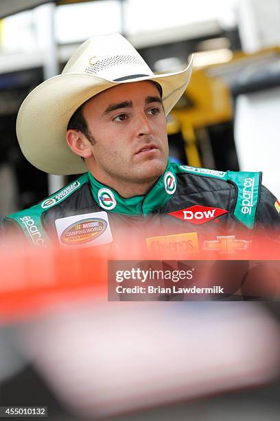 Austin Dillon, driver of the American Ethanol Chevrolet, stands in the garage area during the NASCAR Camping World Truck Series inaugural CarCash...