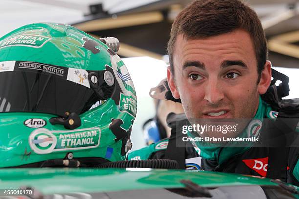 Austin Dillon, driver of the American Ethanol Chevrolet, stands in the garage area during the NASCAR Camping World Truck Series inaugural CarCash...