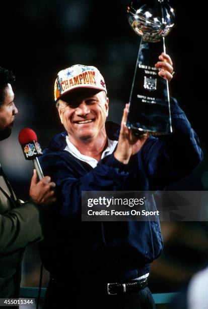 Head Coach Barry Switzer of the Dallas Cowboys holds up the Vince Lombardi Trophy after the Cowboy defeated the Pittsburgh Steelers in Super Bowl XXX...