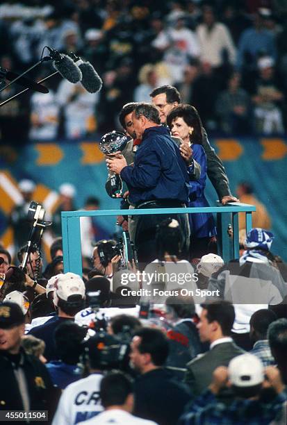 Head Coach Barry Switzer of the Dallas Cowboys holds up the Vince Lombardi Trophy after the Cowboy defeated the Pittsburgh Steelers in Super Bowl XXX...