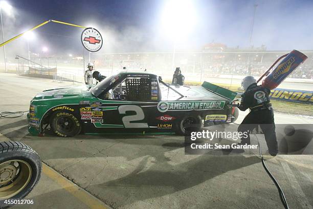 Austin Dillon, driver of the American Ethanol Chevrolet, pits during the NASCAR Camping World Truck Series inaugural CarCash Mudsummer Classic at...