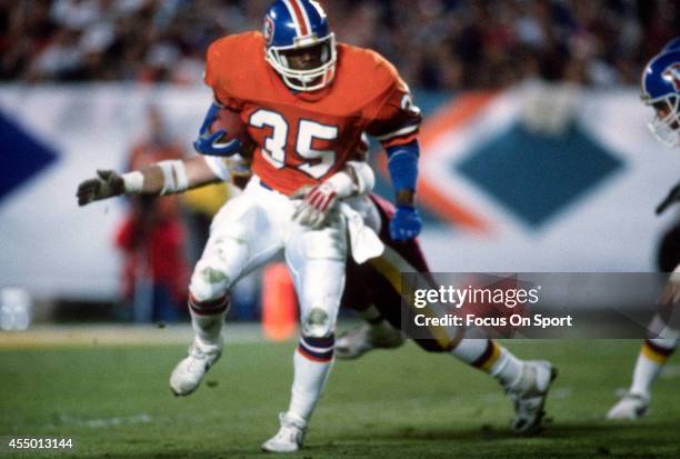 Ken Bell of the Denver Broncos returns a kickoff against the Washington Redskins during Super Bowl XXII on January 31, 1988 at Jack Murphy Stadium in...