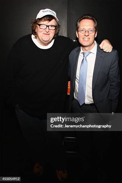 Director / Executive Producer Michael Moore and moderator Thom Powers pose for a portrait during the 25th Anniversary screening of "Roger & Me"...