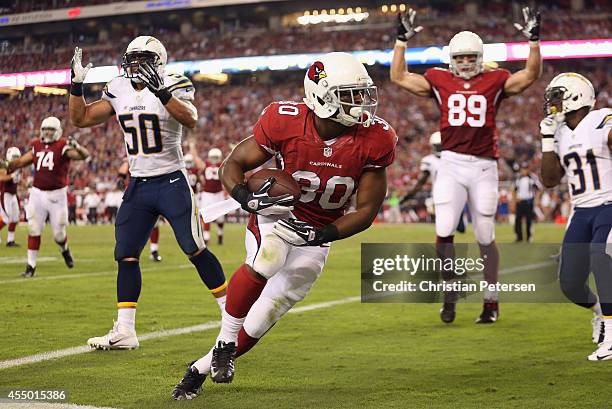 Running back Stepfan Taylor of the Arizona Cardinals crosses the goal line for a 5 yard touchdown in the fourth quarter during the NFL game against...