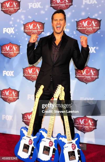 Singer Luke Bryan poses in th press room during the American Country Awards 2013 at the Mandalay Bay Events Center on December 10, 2013 in Las Vegas,...