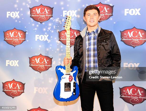 Singer Scotty McCreery poses in th press room during the American Country Awards 2013 at the Mandalay Bay Events Center on December 10, 2013 in Las...