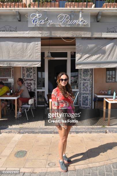 Actress Sonja Kirchberger poses in front of her restaurant Ca'n Punta on September 6, 2014 in the harbour of Molinar near Palma de Mallorca, Spain.