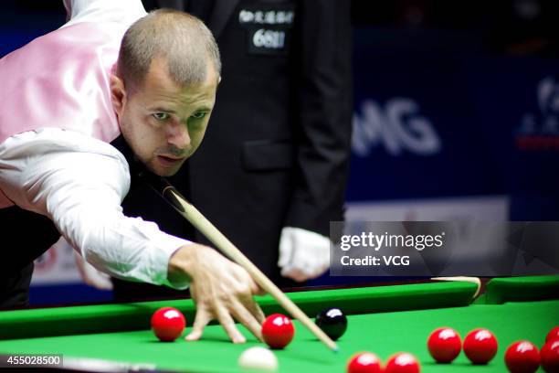 Barry Hawkins of England plays a shot in the match against Mark Williams of Wales during day two of the World Snooker Bank of Communications OTO...