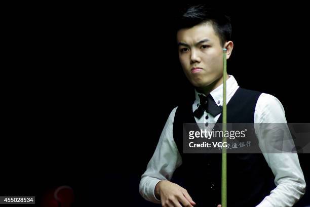 Huang Jiajie of China looks on in the match against Ken Doherty of Ireland during day two of the World Snooker Bank of Communications OTO Shanghai...