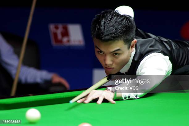 Huang Jiajie of China plays a shot in the match against Ken Doherty of Ireland during day two of the World Snooker Bank of Communications OTO...