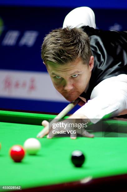 Ryan Day of Wales plays a shot in the match against John Higgins of Scotland during day two of the World Snooker Bank of Communications OTO Shanghai...