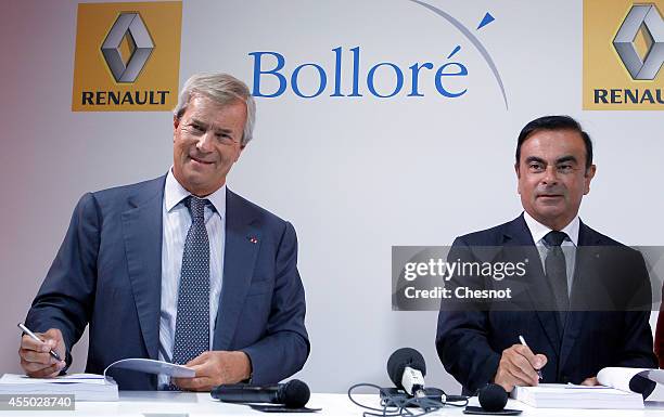 The CEO of French carmaker Renault, Carlos Ghosn and French industrial group Bollore head Vincent Bollore give a press conference at the Atelier...