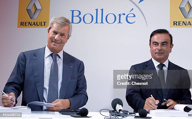 The CEO of French carmaker Renault, Carlos Ghosn and French industrial group Bollore head Vincent Bollore give a press conference at the Atelier...