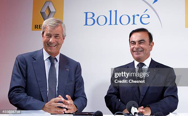 The CEO of French carmaker Renault, Carlos Ghosn and French industrial group Bollore head Vincent Bollore give a press conference at the Atelier...