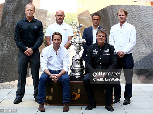 Jimmy Spithill, Max Sirena, Franck Cammas and Sir Ben Ainslie and Dean Barker pose for photographers after the Americas Cup press conference to...