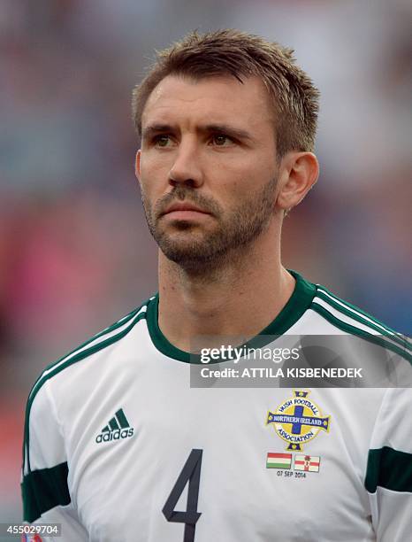 Northern Ireland defender Gareth McAuley listens to his national anthem prior to the UEFA Euro 2016 Group F qualifying football match of Hungary vs...