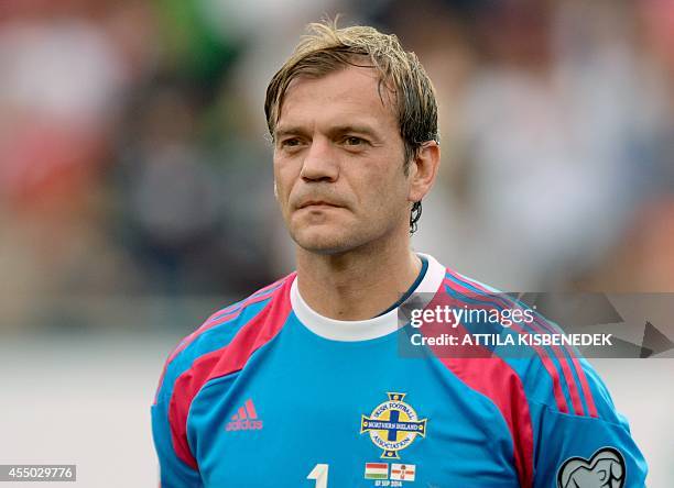 Northern Ireland goalkeeper Roy Carroll listens to his national anthem prior to the UEFA Euro 2016 Group F qualifying football match of Hungary vs...