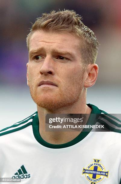 Northern Ireland captain Steven Davis listens to his national anthem prior to the UEFA Euro 2016 Group F qualifying football match of Hungary vs...