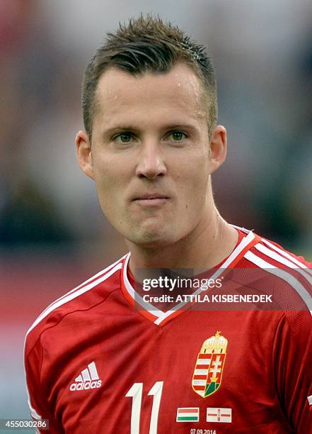 Hungary's midfielder Daniel Tozser listens to his national anthem prior to the UEFA Euro 2016 Group F qualifying football match of Hungary vs...