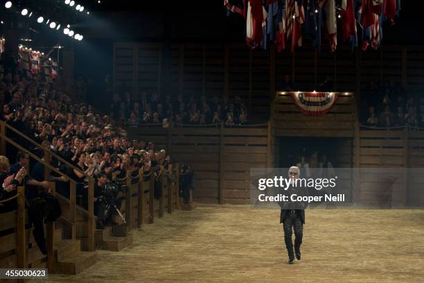 Karl Lagerfeld walks the runway after the Chanel "Metiers d'Art" Show at Fair Park on December 10, 2013 in Dallas, Texas.