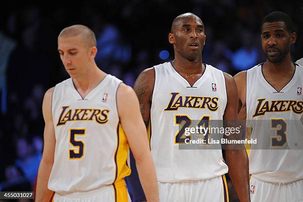 Kobe Bryant of the Los Angeles Lakers looks on during the game against the Toronto Raptors at Staples Center on December 8, 2013 in Los Angeles,...