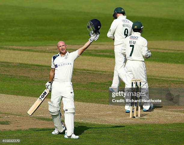 Adam Lyth of Yorkshire celebrates as he reaches his century during the first day of the LV County Championship match between Nottinghamshire and...