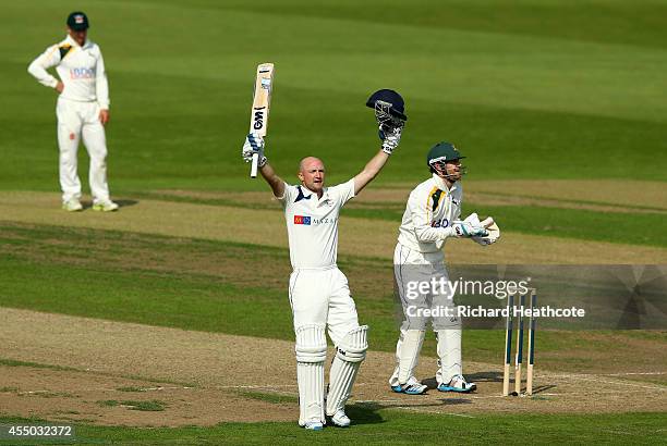 Adam Lyth of Yorkshire celebrates as he reaches his century during the first day of the LV County Championship match between Nottinghamshire and...