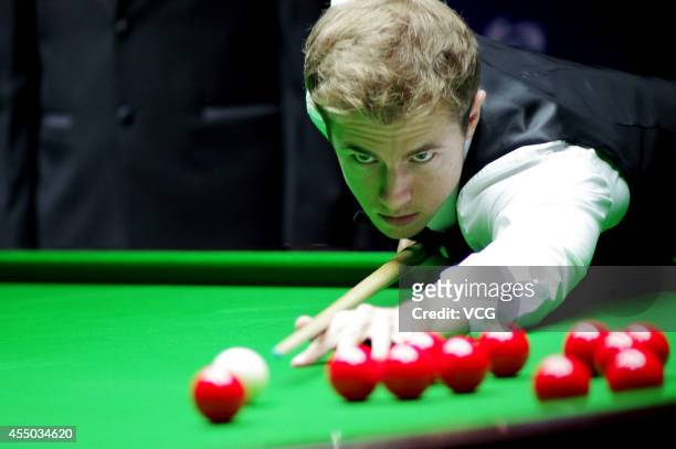 Jack Lisowski of England plays a shot in the match against Ding Junhui of China during day two of the World Snooker Bank of Communications OTO...