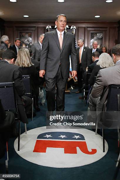 Speaker of the House John Boehner leaves a press conference following a closed-door conference meeting at the Republican National Committee...