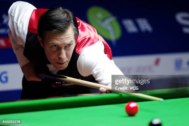 Dominic Dale of Wales plays a shot in the match against Judd Trump of England during day two of the World Snooker Bank of Communications OTO Shanghai...