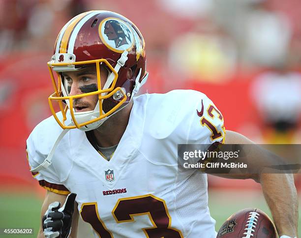 Wide receiver Nick Williams of the Washington Redskins warms up before the game with the Tampa Bay Buccaneers at Raymond James Stadium on August 28,...