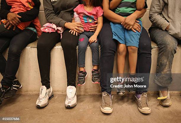 Women and children sit in a holding cell at a U.S. Border Patrol processing center after being detained by agents near the U.S.-Mexico border on...