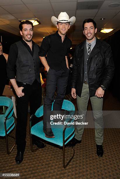 Television personality Jonathan Scott, recording artist Justin Moore and television personality Drew Scott attend the Backstage Creations Celebrity...